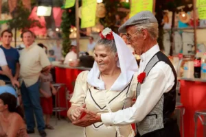 Two people dancing and celebrating the Verbena de la Paloma